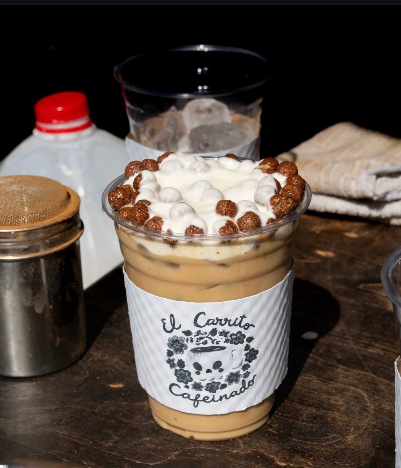 A signature El Carrito Cafeinado drink with cinnamon and cream