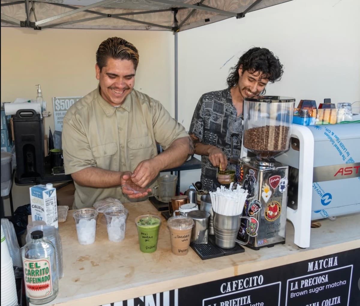 A drink held up to the Guisados Pasadena window